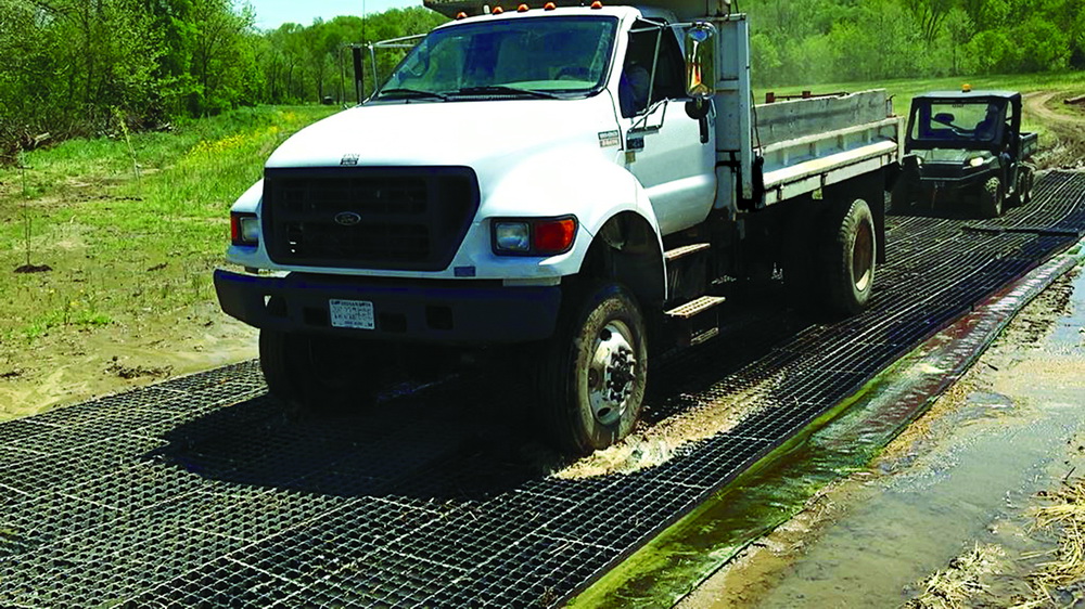 The GeoTerra® Portable Mat system helps bridge soft. organic, soils while supporting heavy loads
