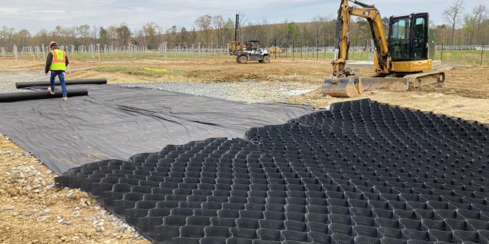 installing geotextile and geocells for solar site access road