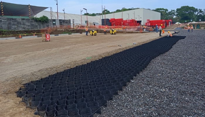 workers installing geoweb geocells in parking lot in guatemala